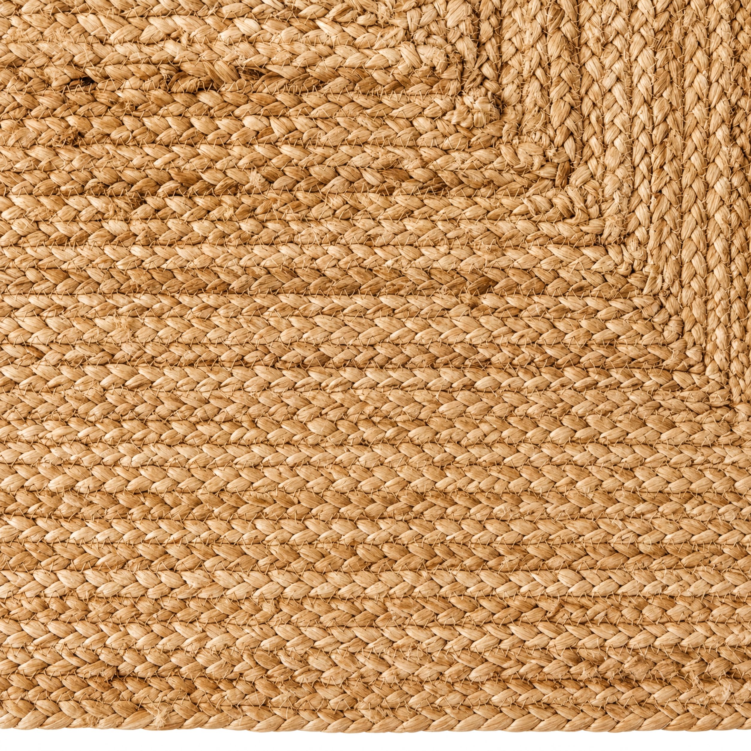 a close-up view of a woven fabric with a textured, woven appearance. The fabric appears to be made of a natural, woven material, possibly jute or similar. The image does not contain any text or other discernible objects or actions.