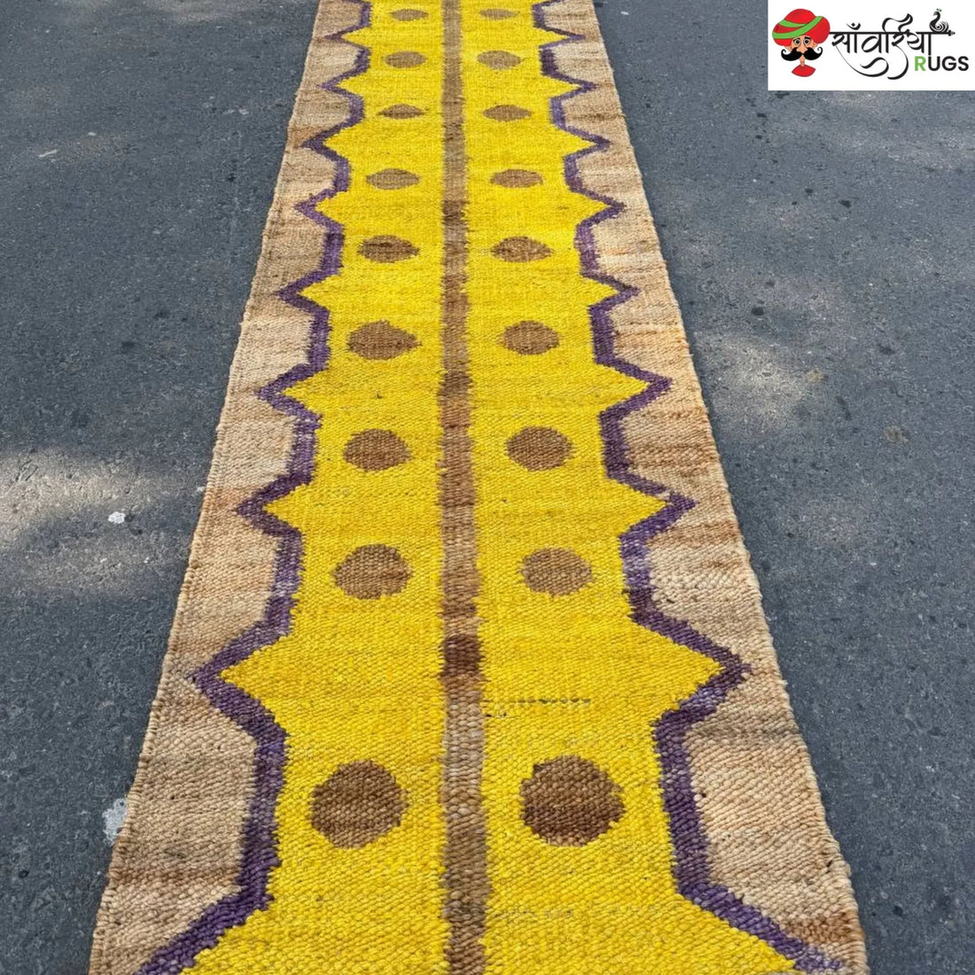 Yellow jute runner rug with geometric brown and purple pattern