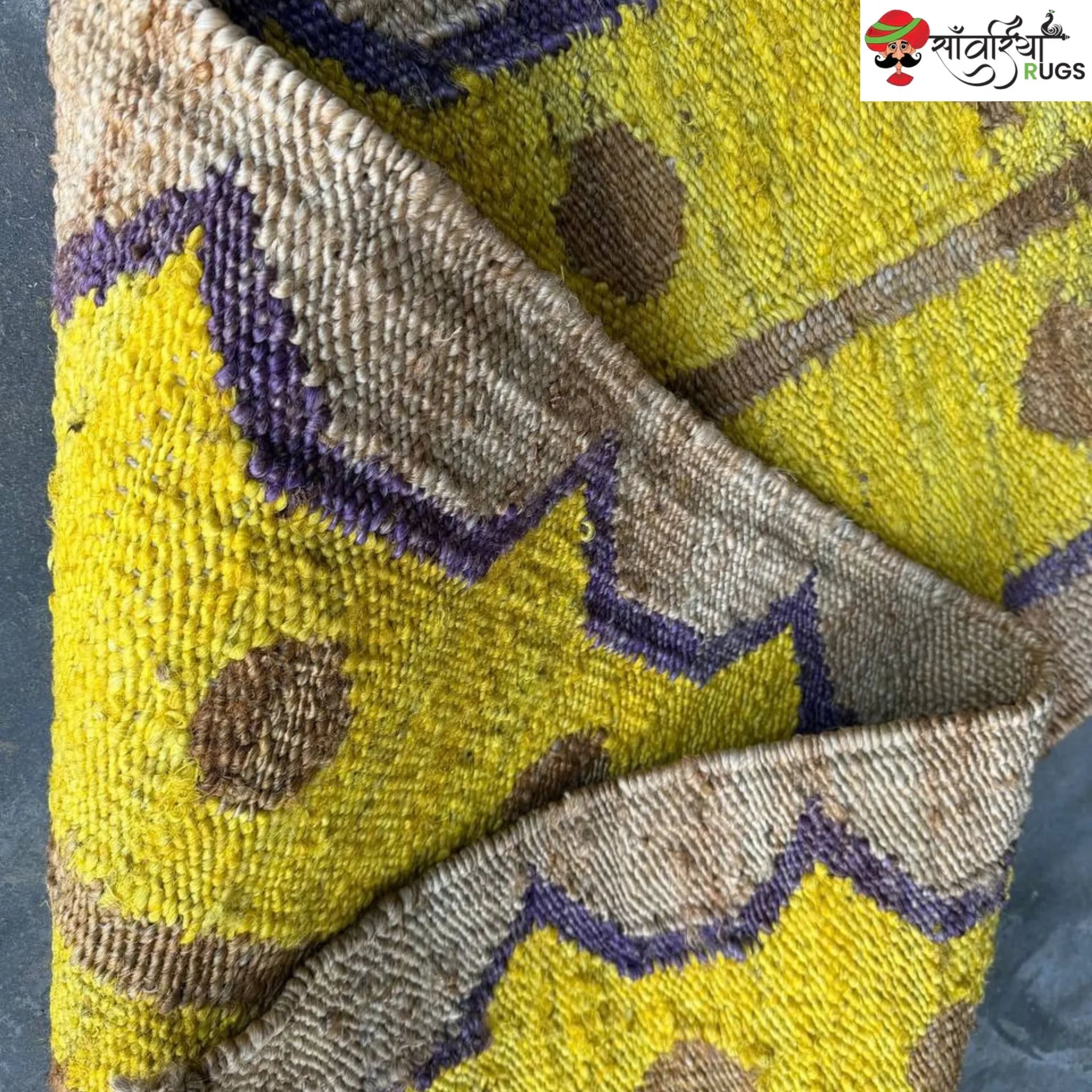 Yellow jute runner rug with geometric brown and purple pattern