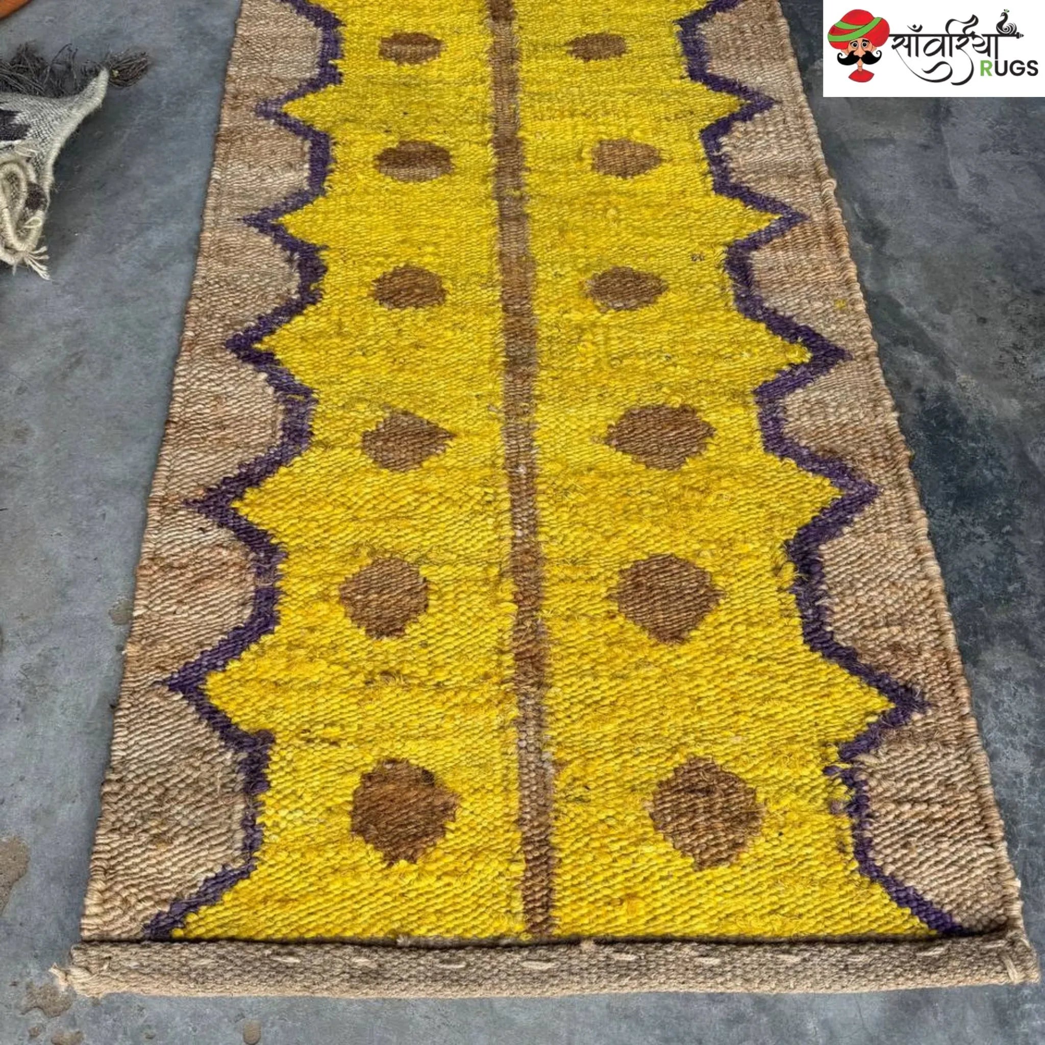 Yellow jute runner rug with geometric brown and purple pattern