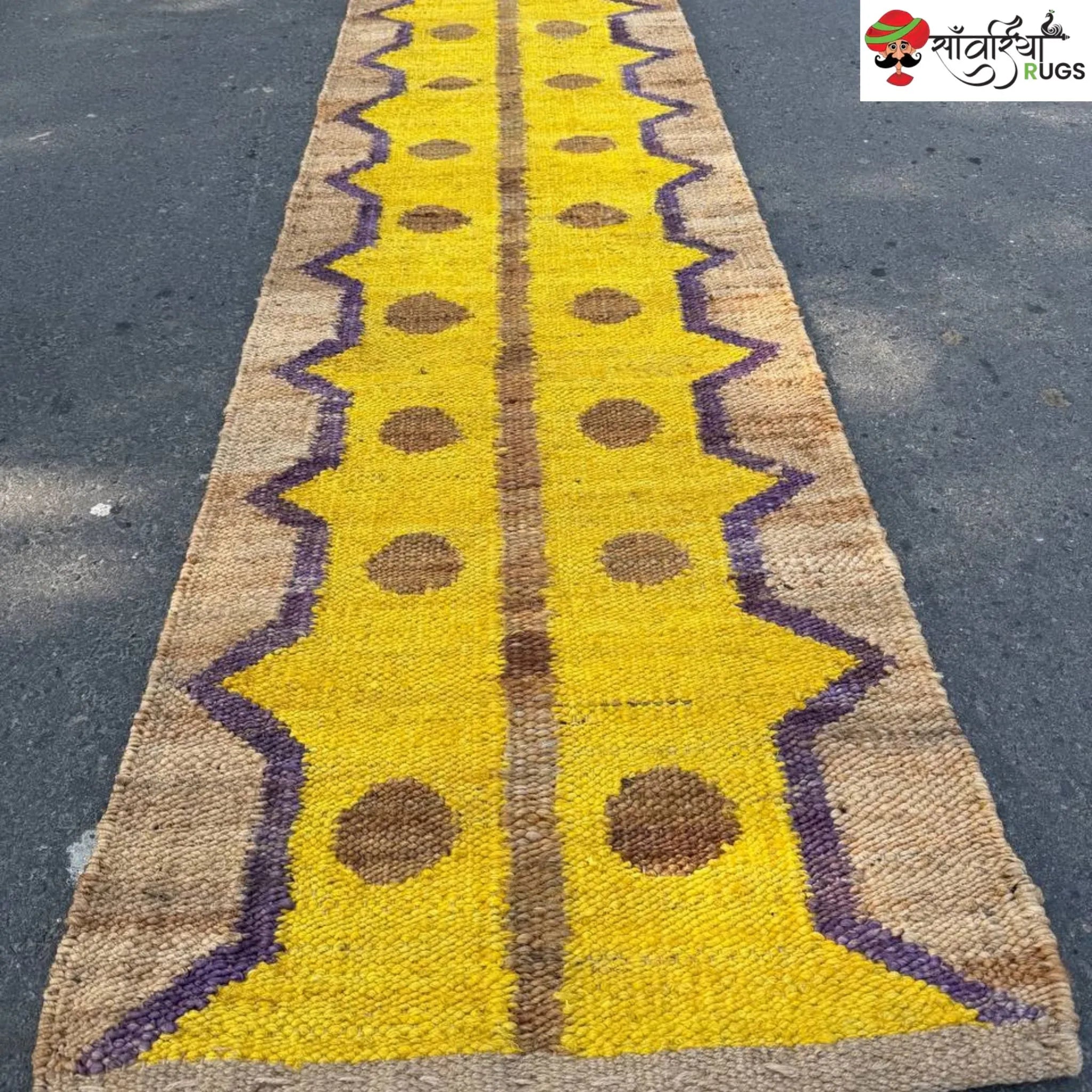 Yellow jute runner rug with geometric brown and purple pattern