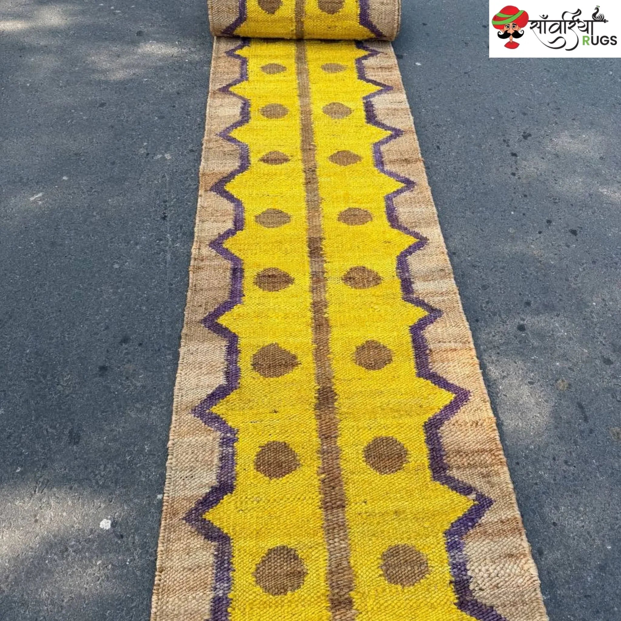 Yellow jute runner rug with geometric brown and purple pattern