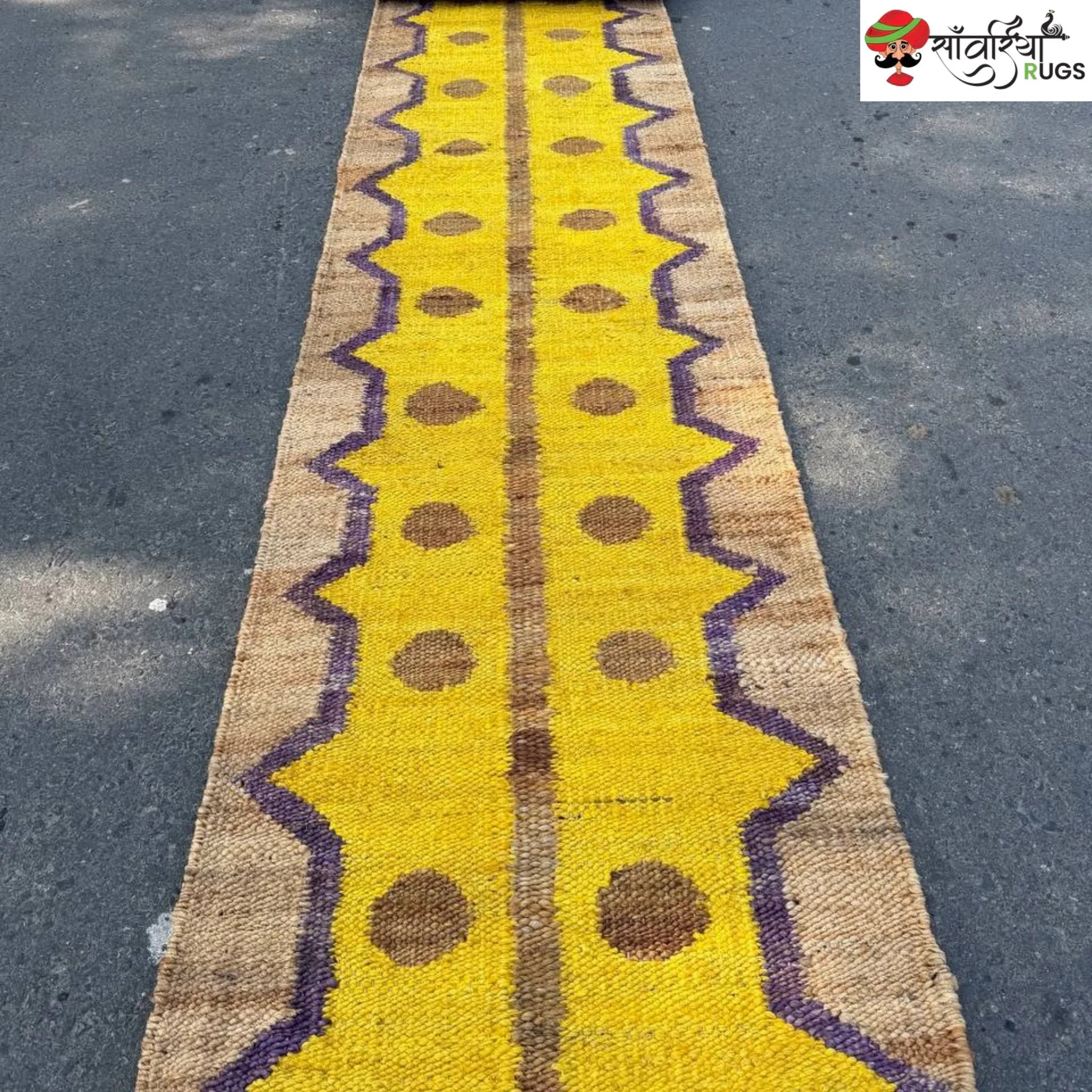 Yellow jute runner rug with geometric brown and purple pattern