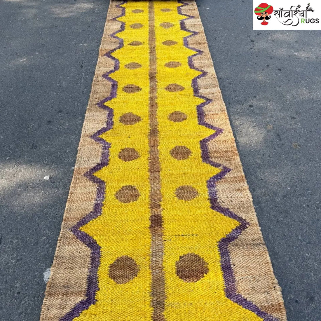 Yellow jute runner rug with geometric brown and purple pattern