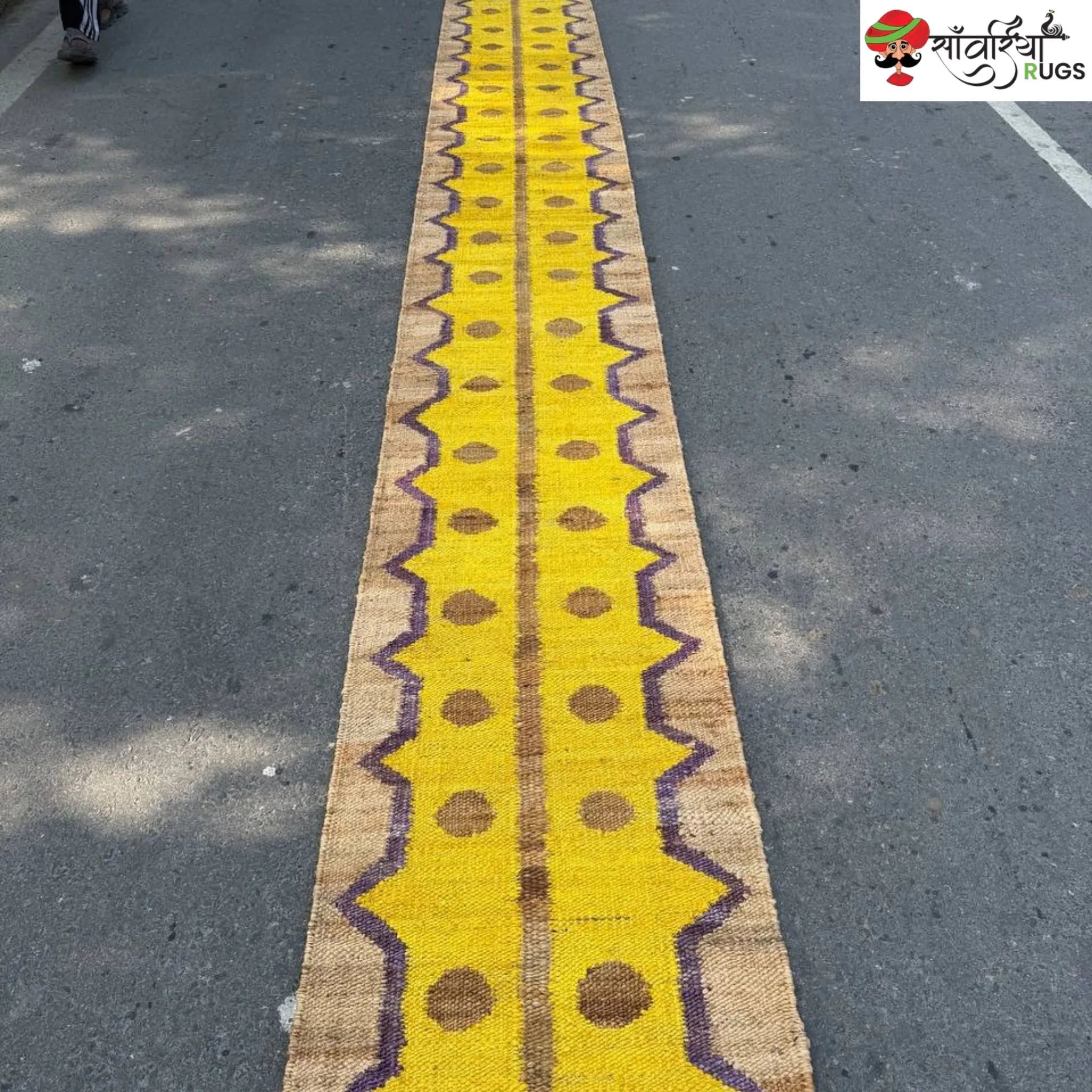 Yellow jute runner rug with geometric brown and purple pattern