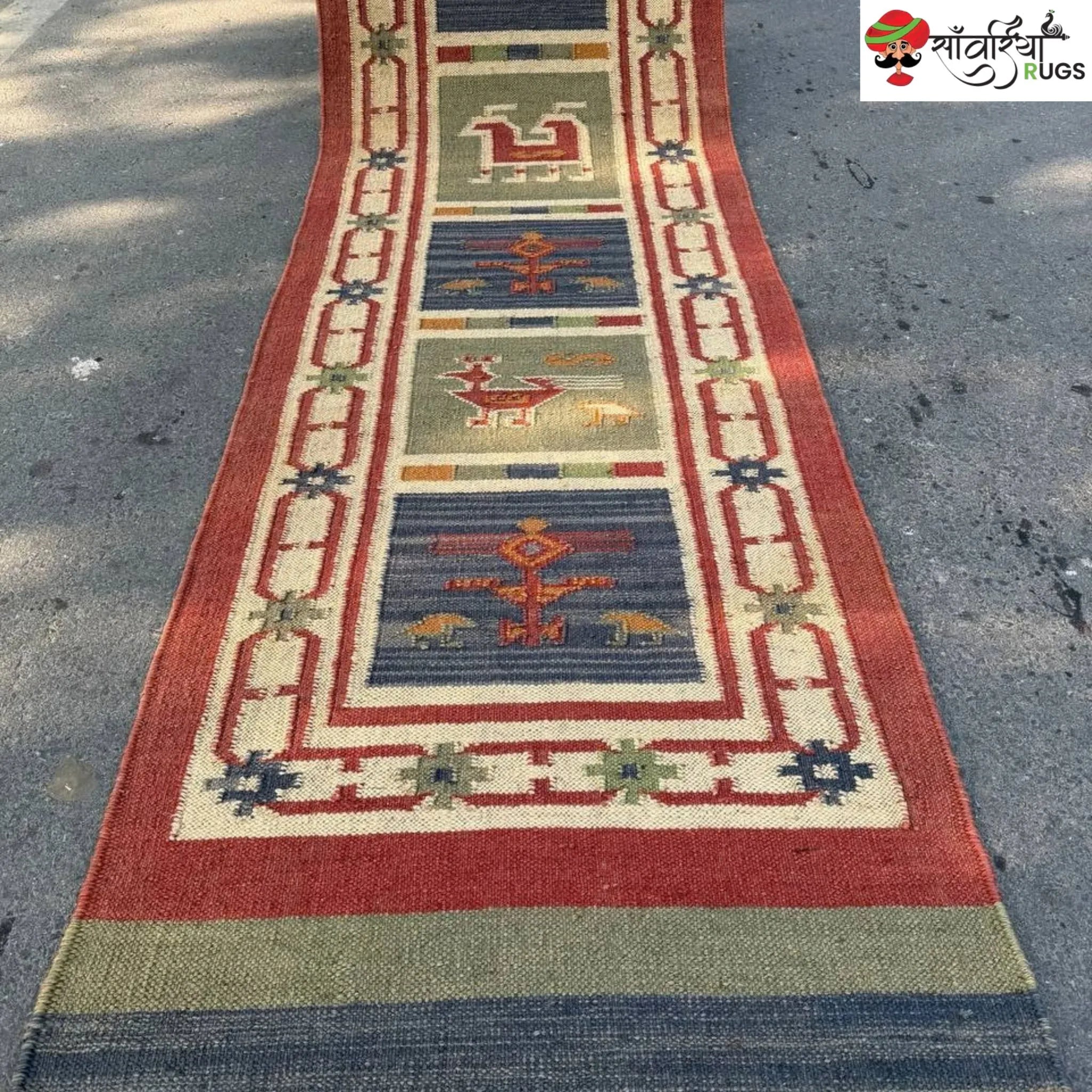 Handwoven kilim runner rug with geometric and animal motifs