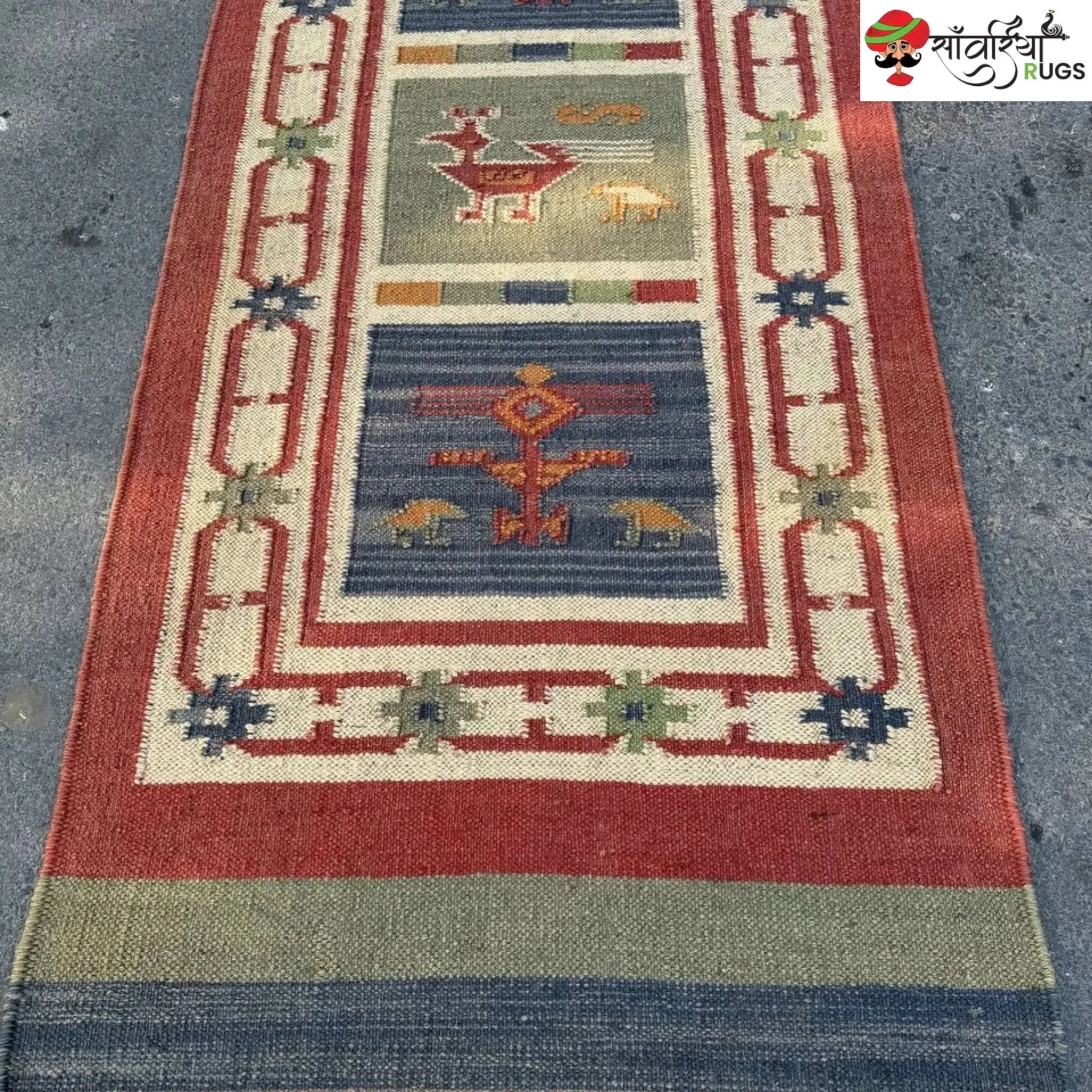 Handwoven kilim runner rug with geometric and animal motifs