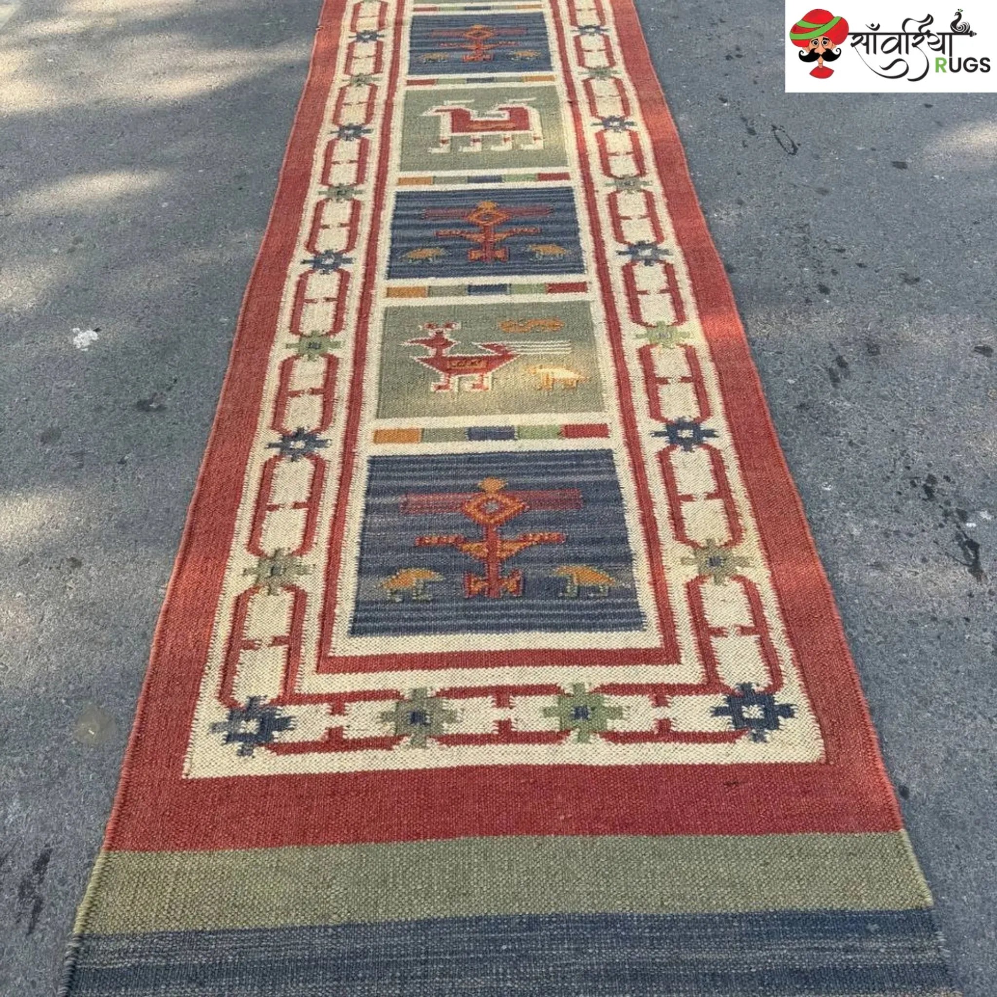 Handwoven kilim runner rug with geometric and animal motifs