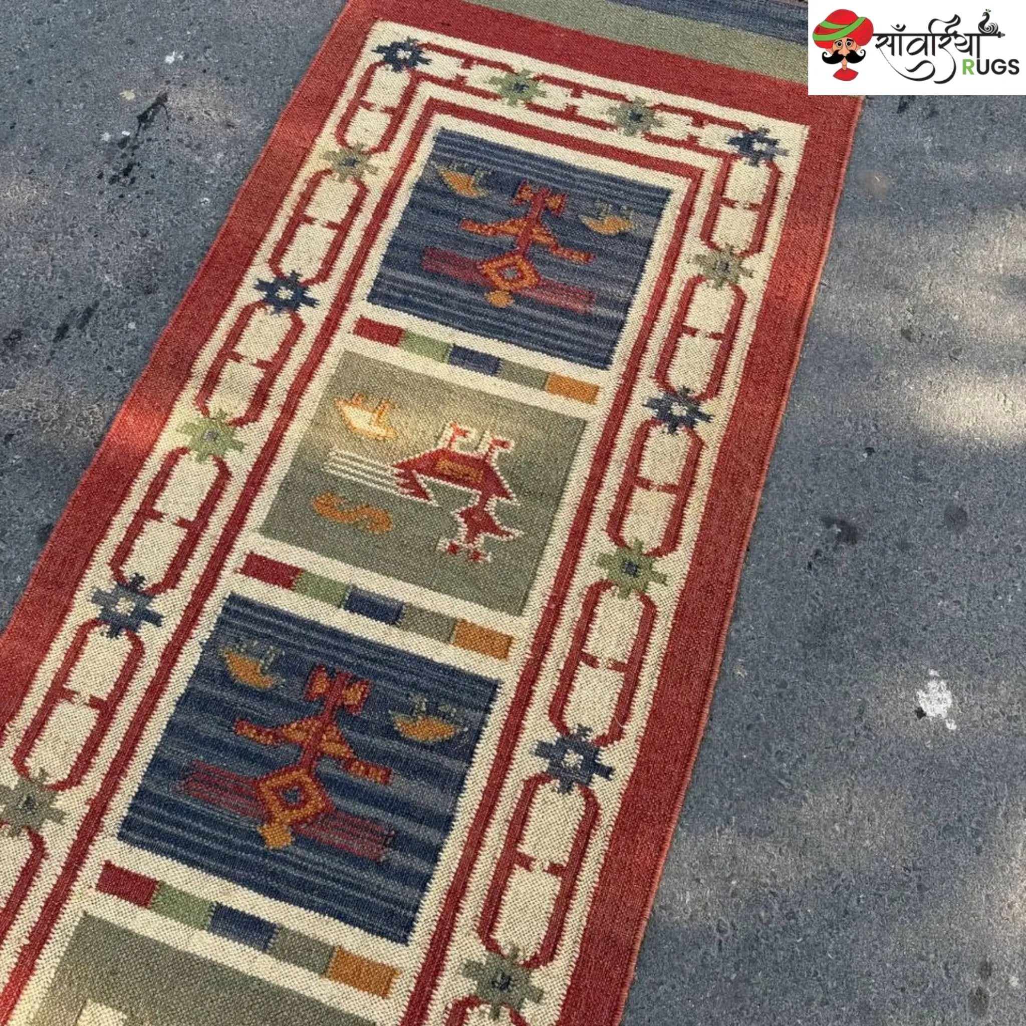 Handwoven kilim runner rug with geometric and animal motifs