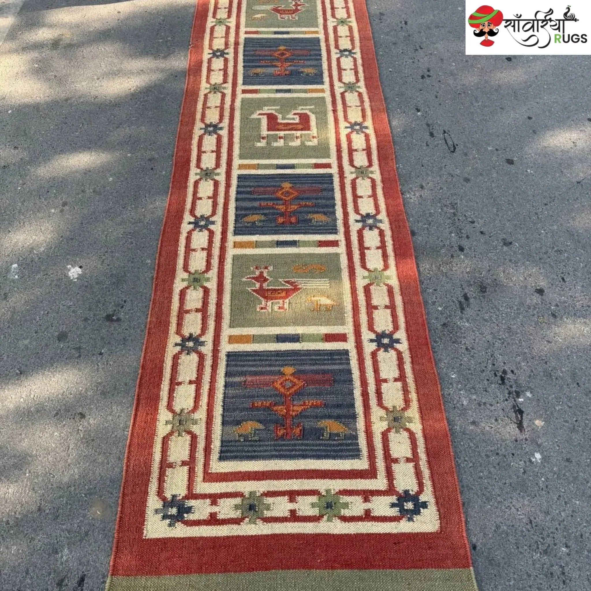 Handwoven kilim runner rug with geometric and animal motifs