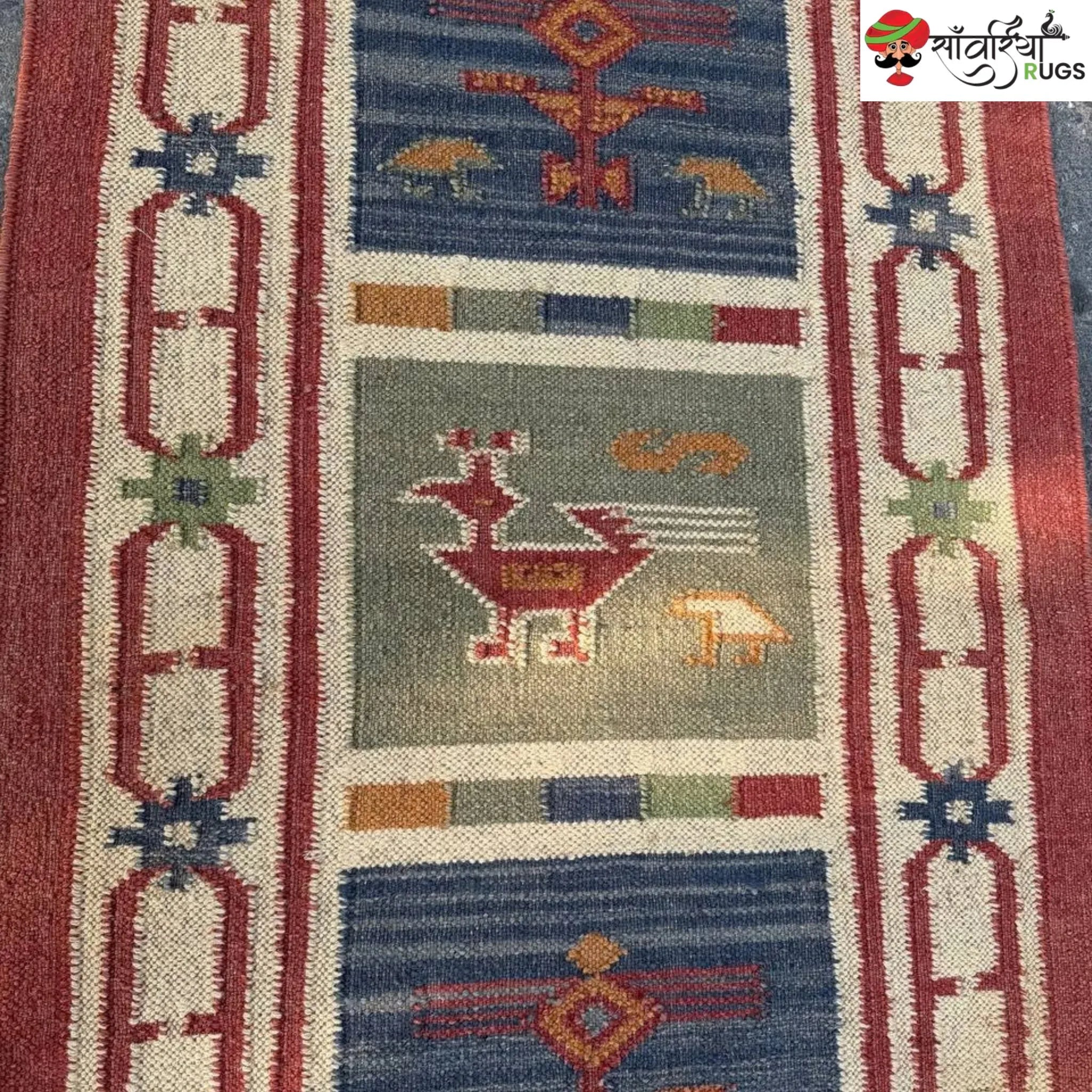 Handwoven kilim runner rug with geometric and animal motifs