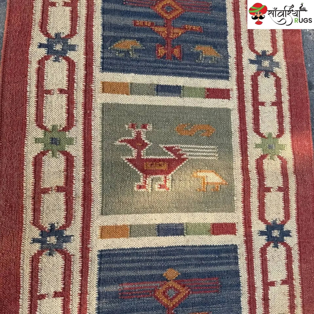 Handwoven kilim runner rug with geometric and animal motifs
