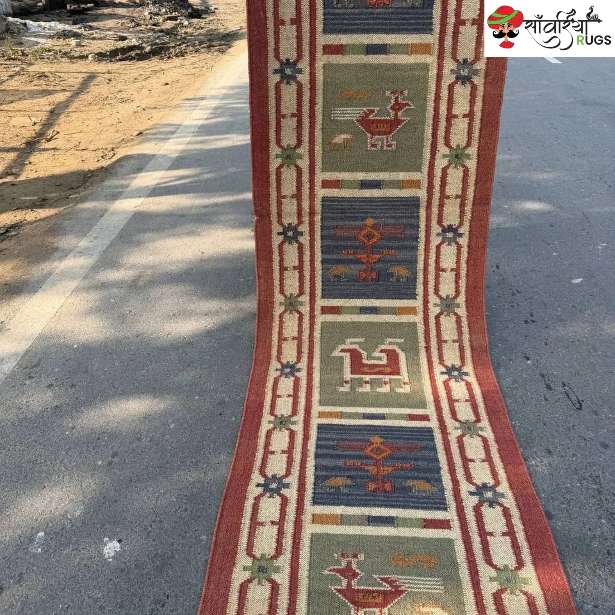 Handwoven kilim runner rug with geometric and animal motifs