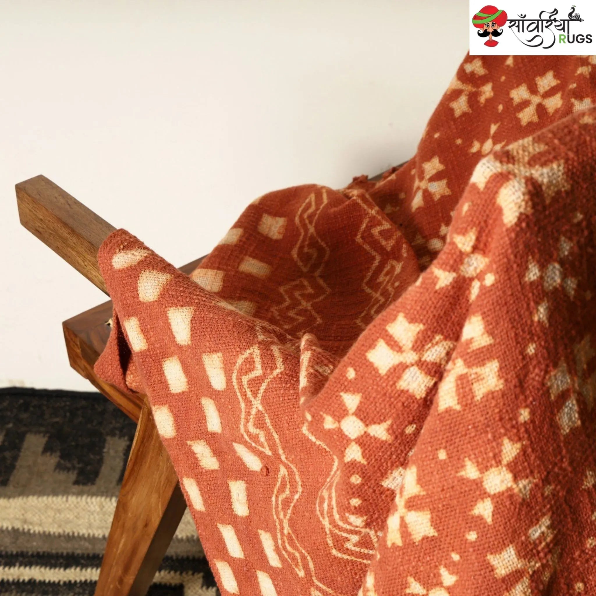 Orange cotton throw blanket with traditional block print design