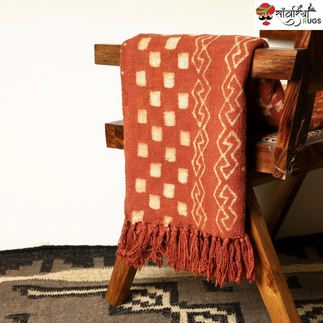 Orange cotton throw blanket with traditional block print design