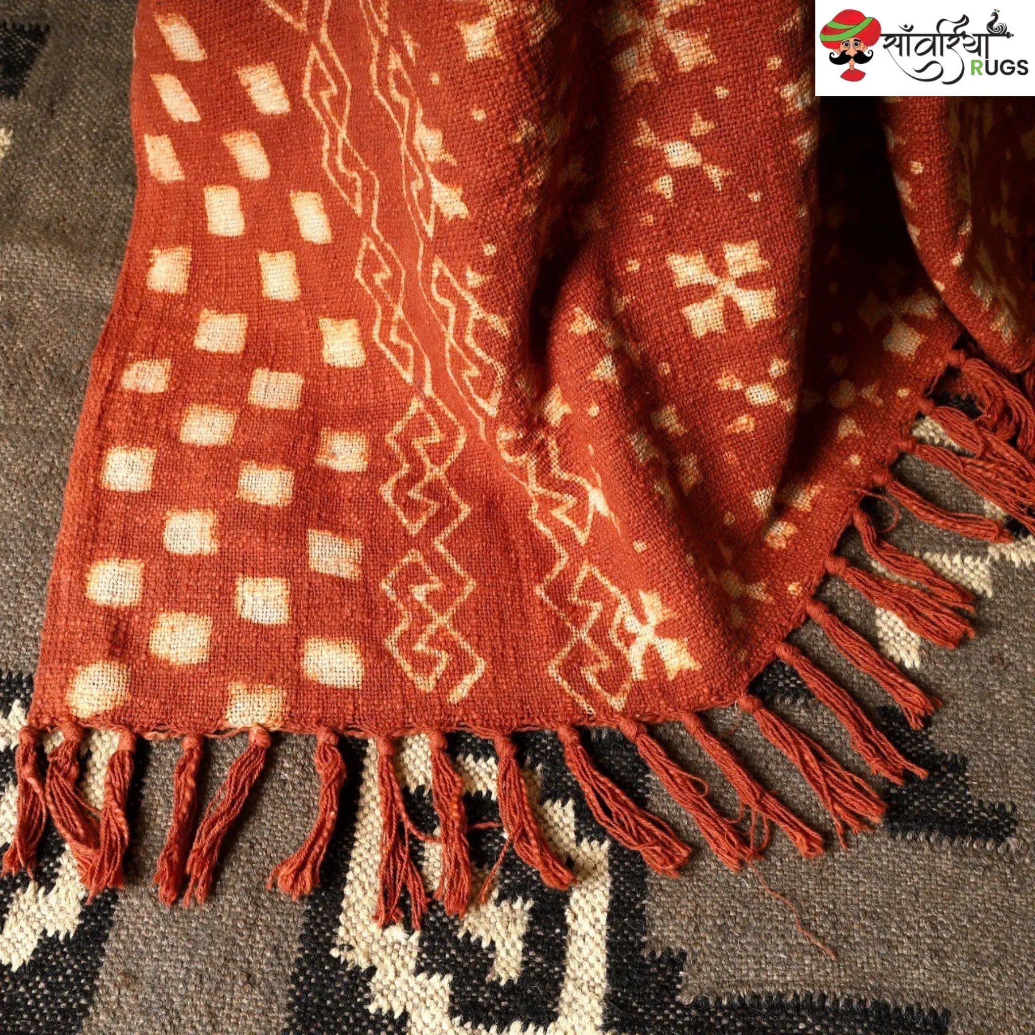 Orange cotton throw blanket with traditional block print design