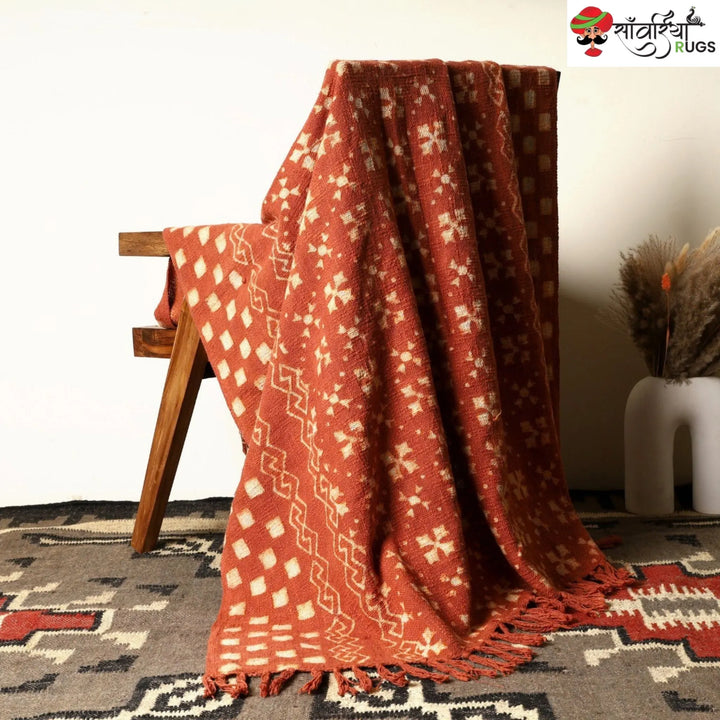 Orange cotton throw blanket with traditional block print design