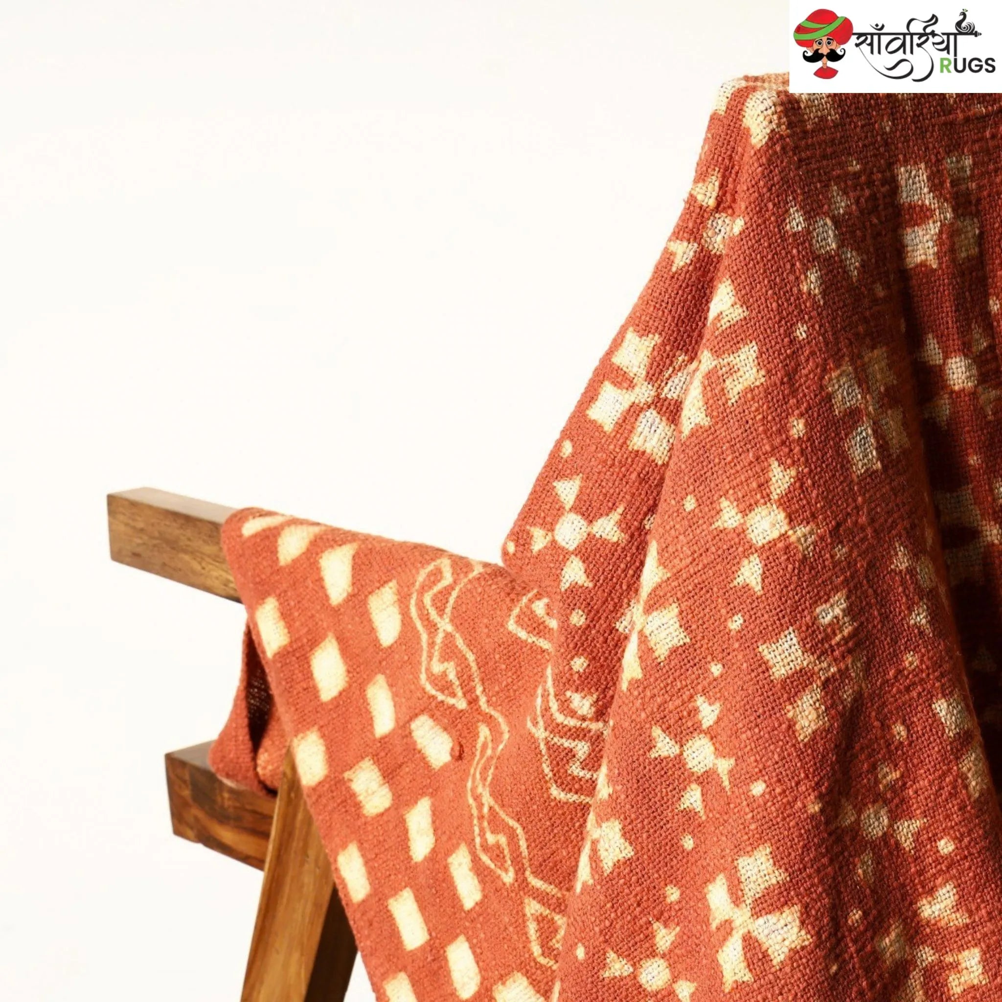 Orange cotton throw blanket with traditional block print design