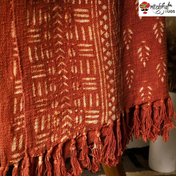 Orange daabu print cotton throw blanket with hand block design