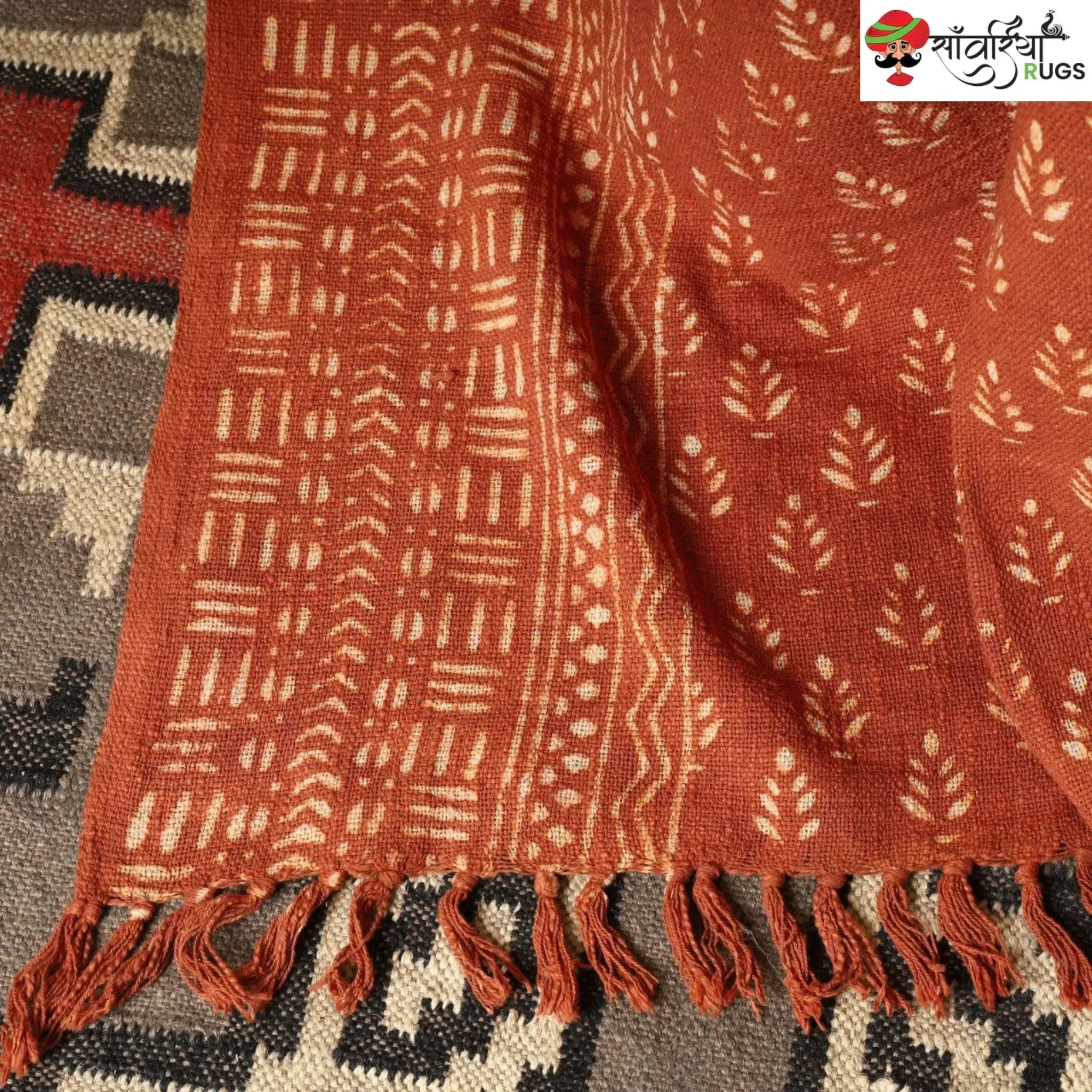 Orange daabu print cotton throw blanket with hand block design