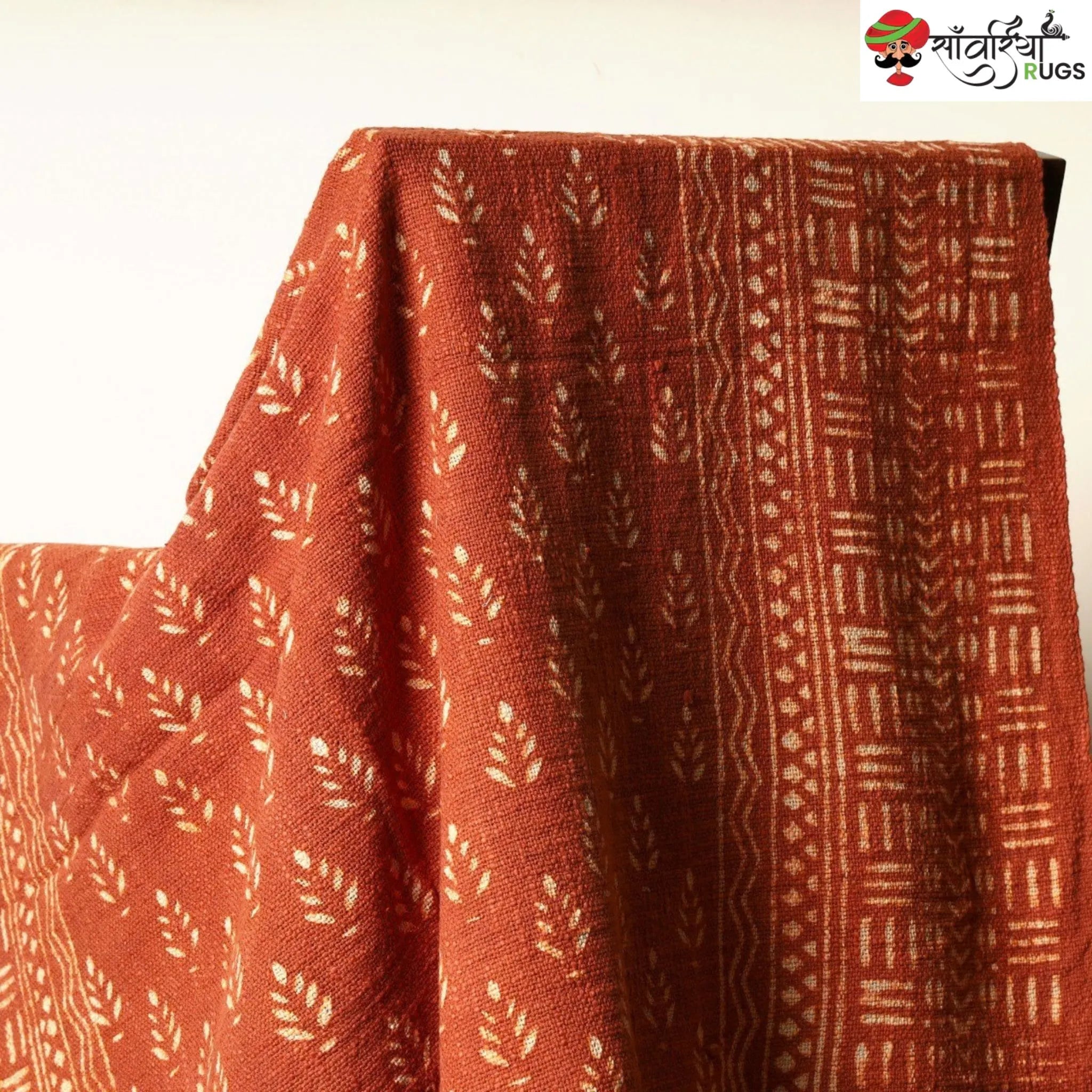 Orange daabu print cotton throw blanket with hand block design