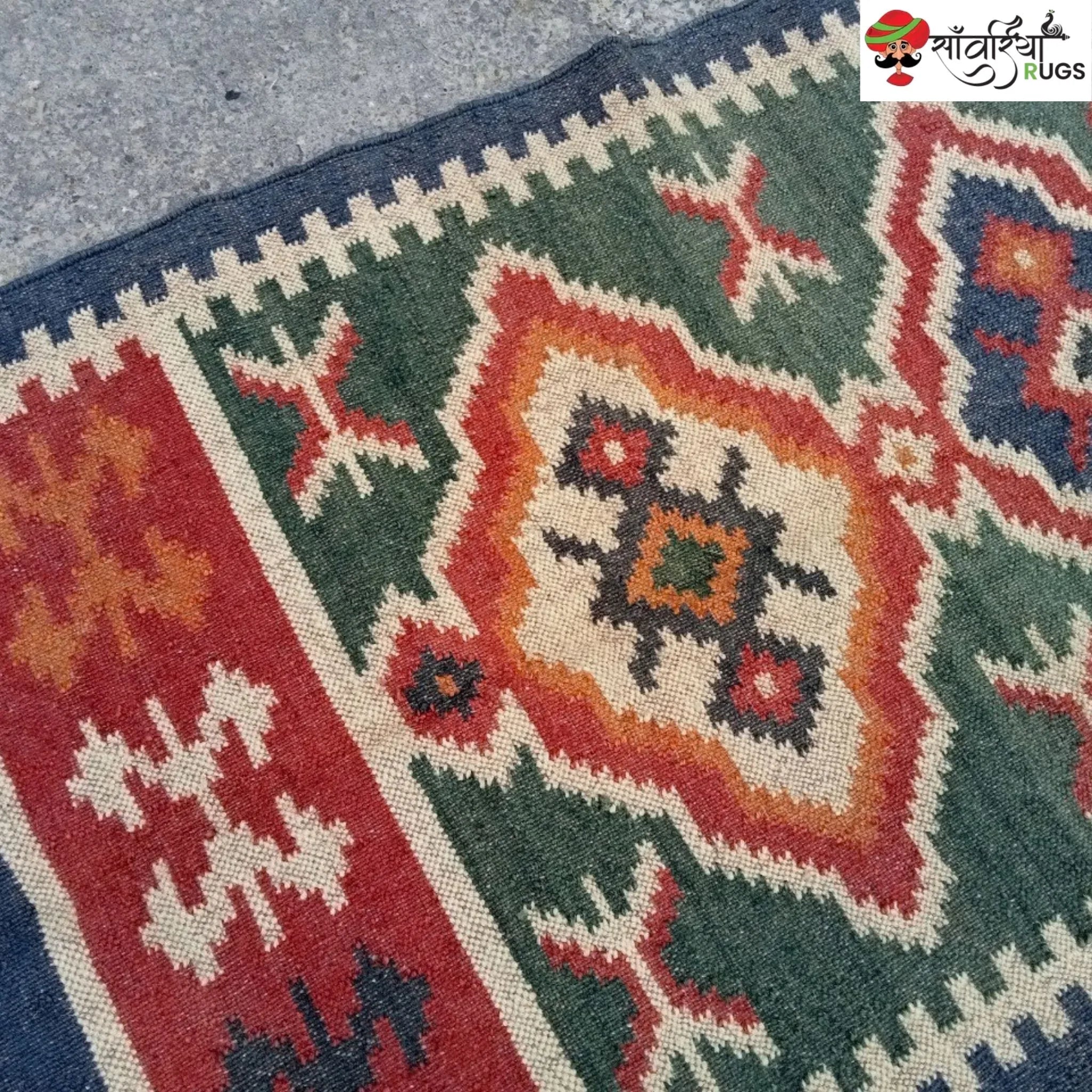 Handmade wool and jute kilim rug with geometric aztec pattern