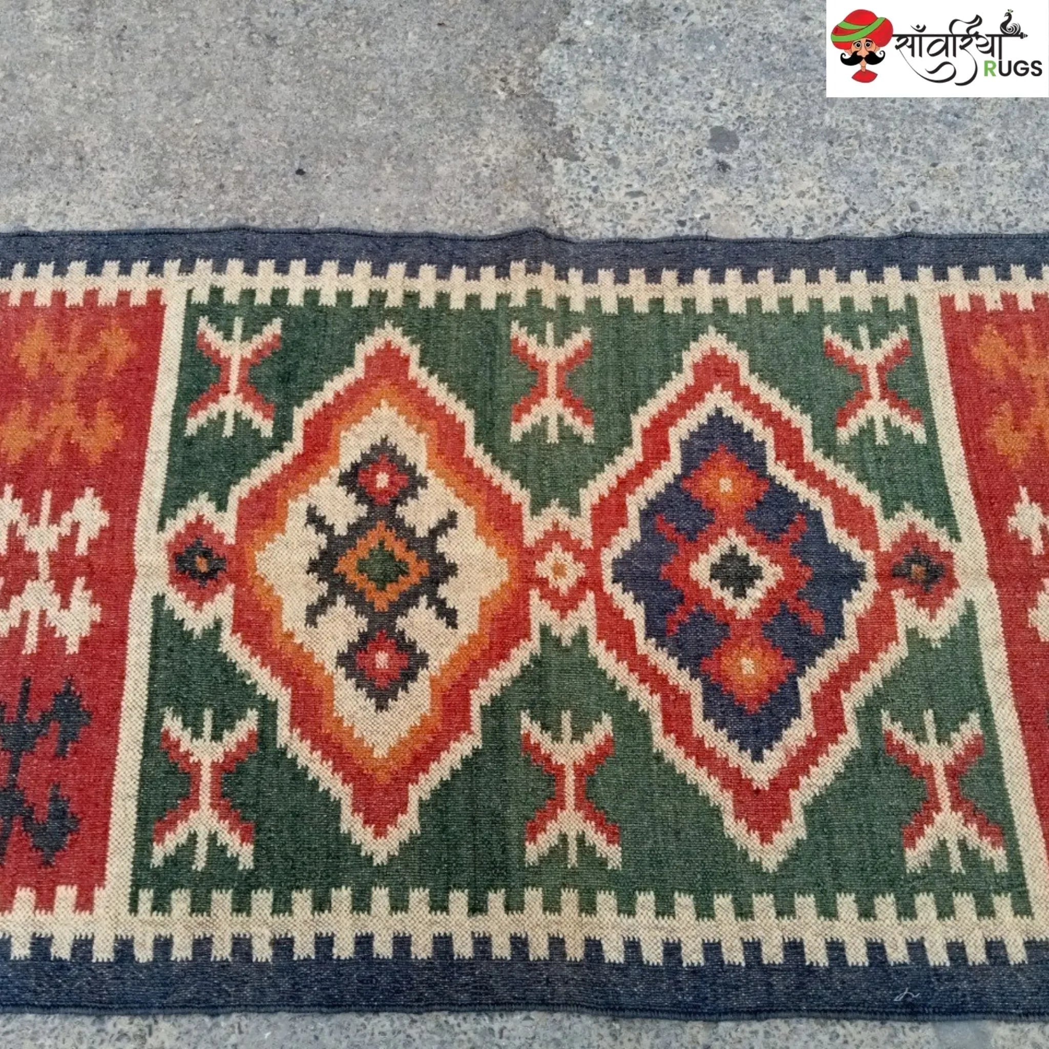 Handmade wool and jute kilim rug with geometric aztec pattern