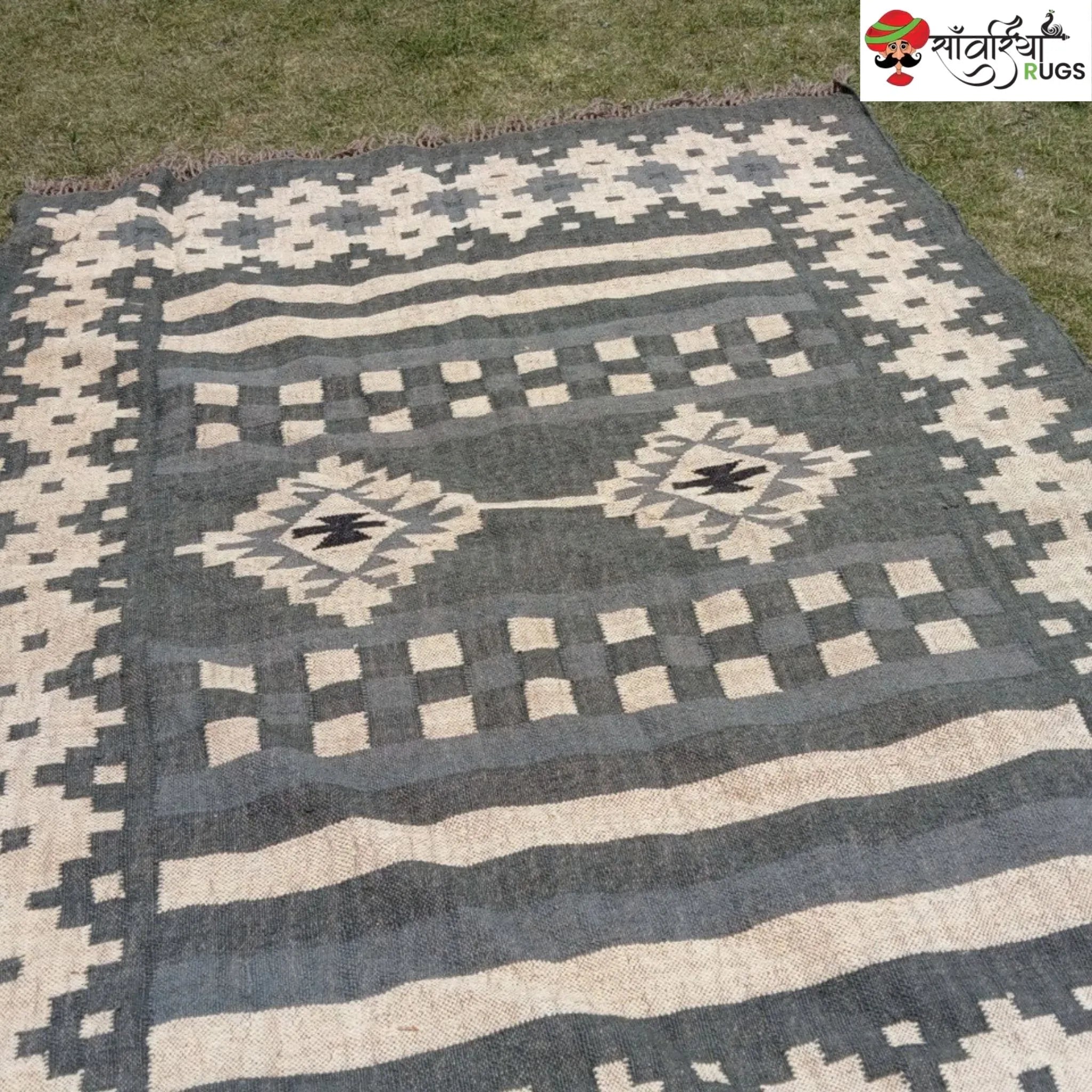 Handwoven wool and jute kilim durrie rug with geometric pattern