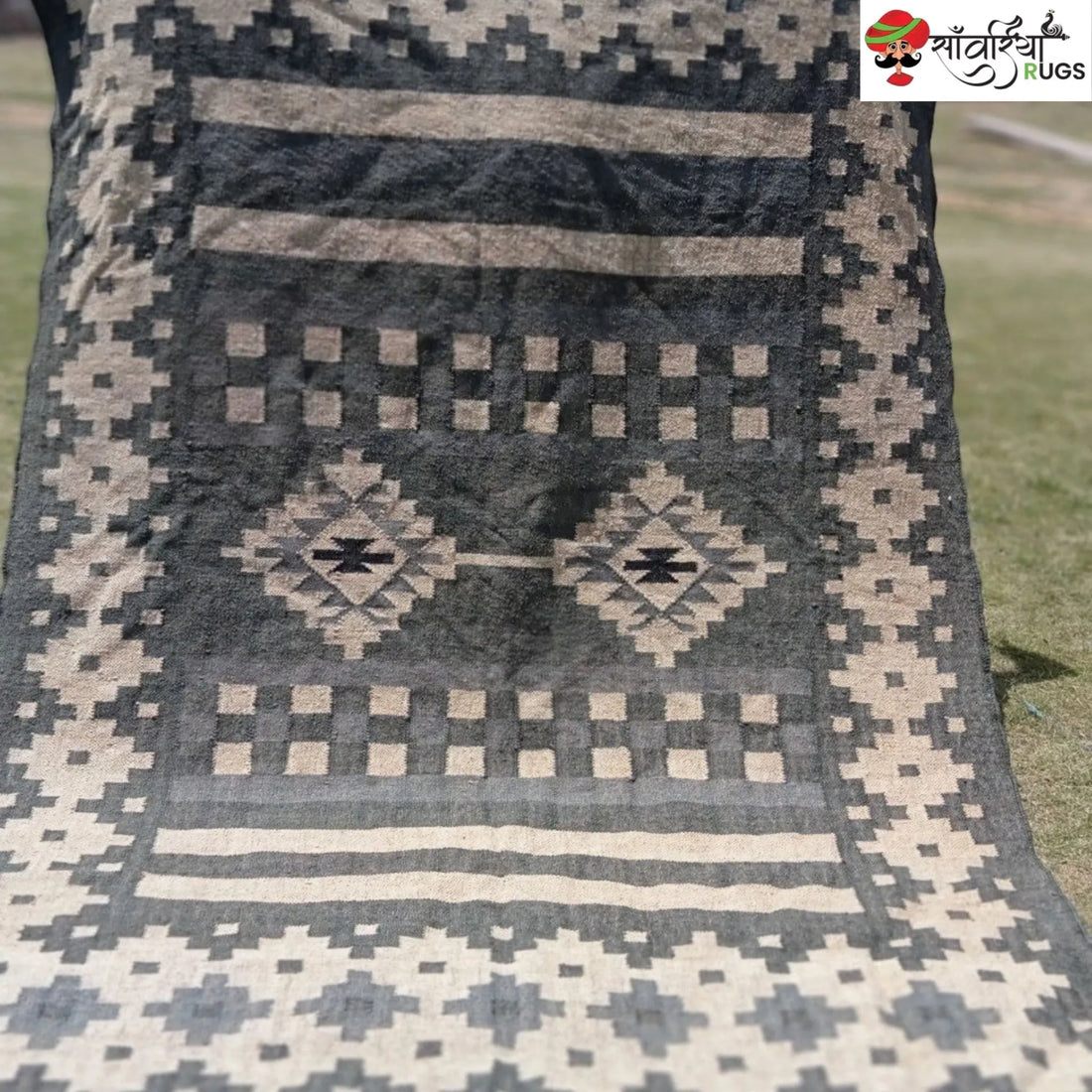 Handwoven wool and jute kilim durrie rug with geometric pattern