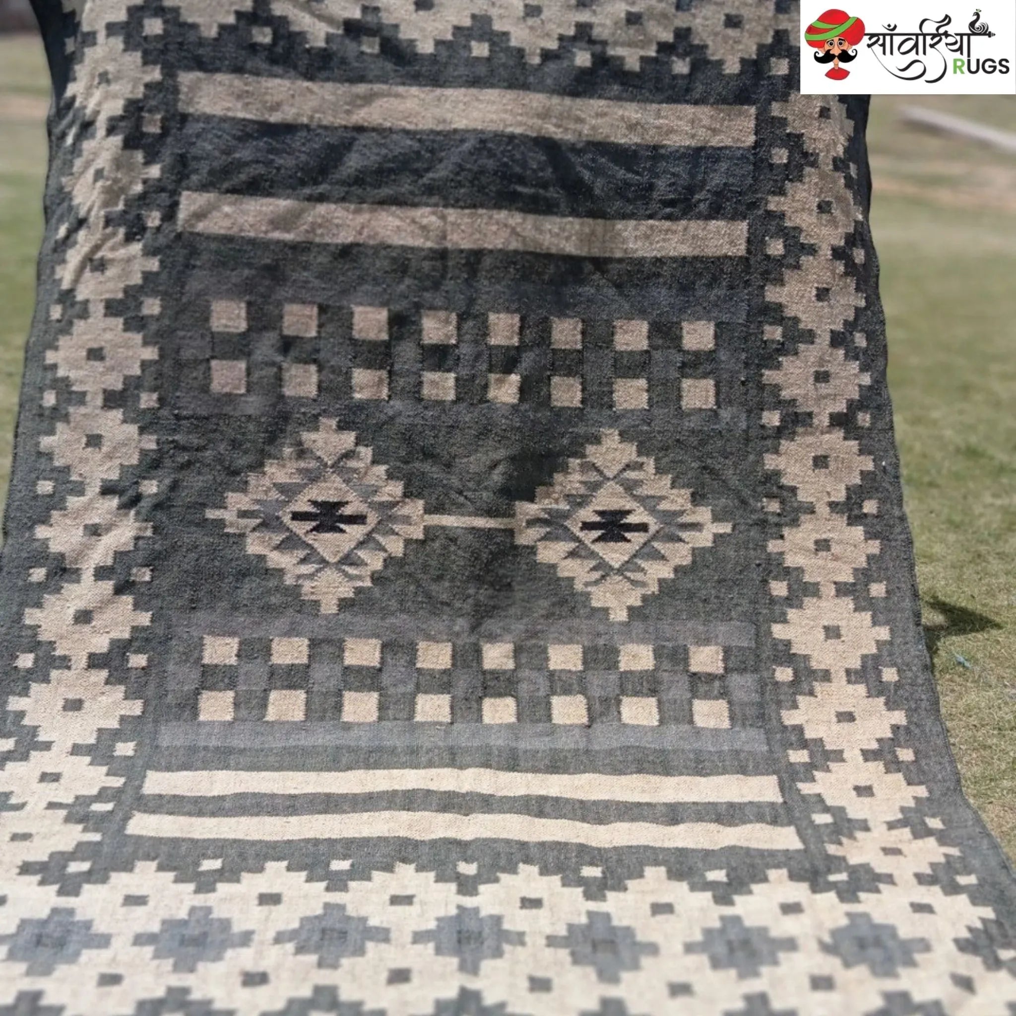 Handwoven wool and jute kilim durrie rug with geometric pattern