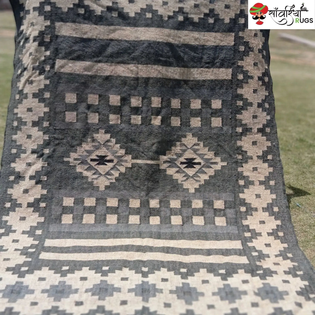 Handwoven wool and jute kilim durrie rug with geometric pattern